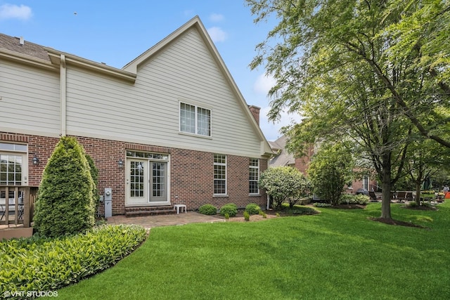 1012 Hickory Dr, Western Springs, IL 60558 - back of house featuring brick siding, a yard, a chimney, and a patio area