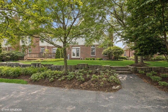1012 Hickory Dr, Western Springs, IL 60558 - view of front of property with brick siding, a front lawn, and a deck