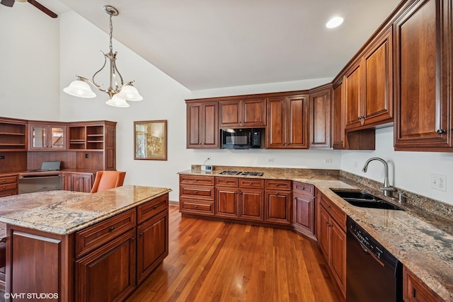 1012 Hickory Dr, Western Springs, IL 60558 - kitchen with black appliances, lofted ceiling, dark wood finished floors, a chandelier, and hanging light fixtures