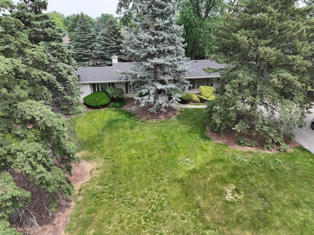 305 S Lambert Rd, Glen Ellyn, IL 60137 - view of front facade with a front lawn, a chimney, roof with shingles, and a wooded view