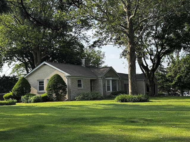 305 S Lambert Rd, Glen Ellyn, IL 60137 - ranch-style home featuring stone siding, a front lawn, and a chimney