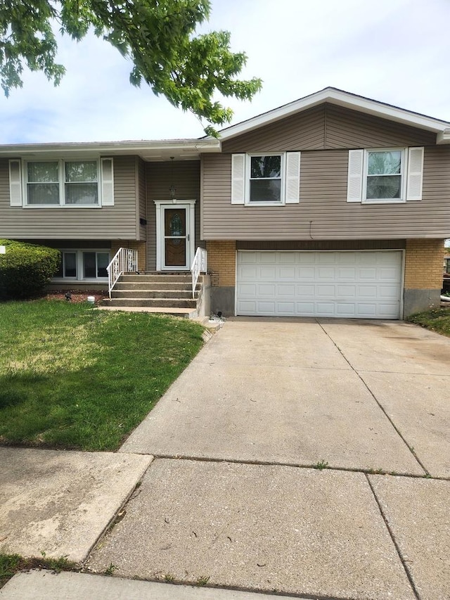 17109 Magnolia Dr, Hazel Crest, IL 60429 - raised ranch featuring a garage, concrete driveway, a front yard, and brick siding