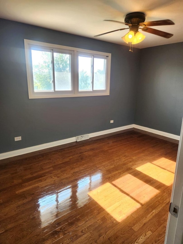 17109 Magnolia Dr, Hazel Crest, IL 60429 - empty room featuring plenty of natural light, ceiling fan, and wood finished floors
