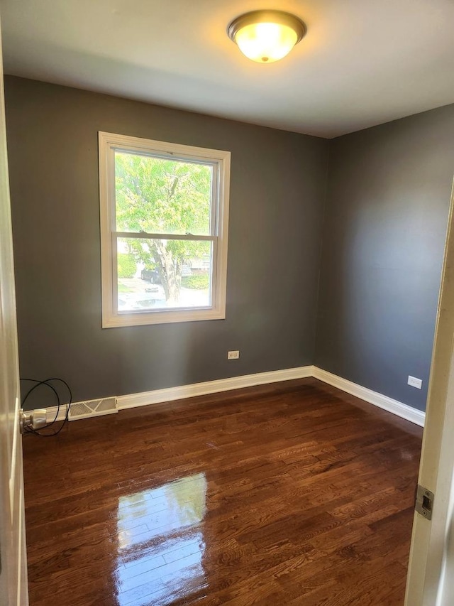 17109 Magnolia Dr, Hazel Crest, IL 60429 - unfurnished room featuring dark wood-type flooring and baseboards