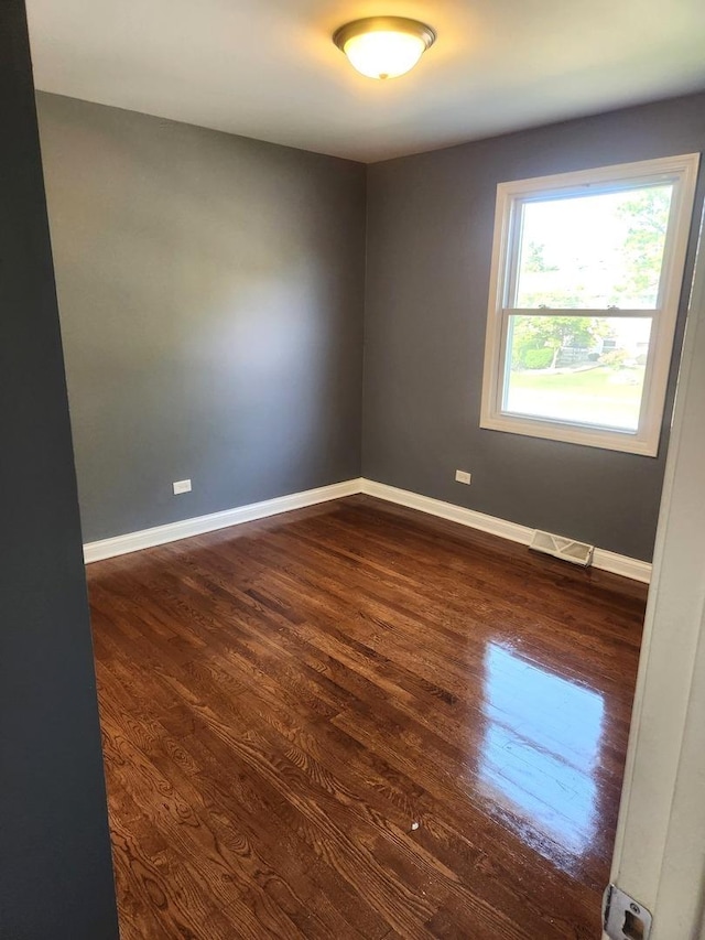 17109 Magnolia Dr, Hazel Crest, IL 60429 - empty room with dark wood-style flooring and baseboards