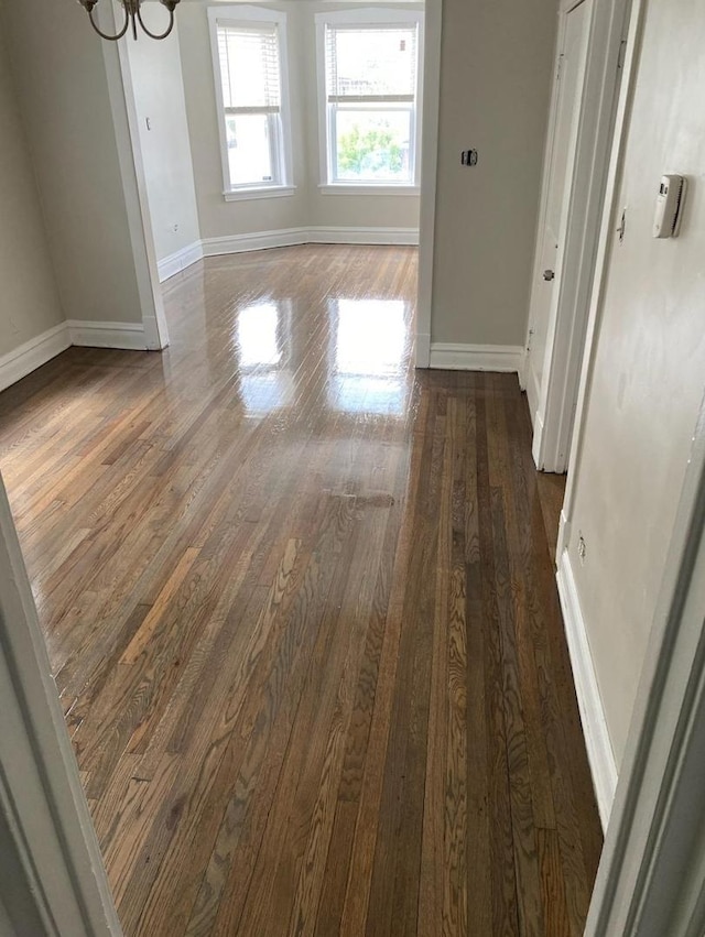 5006 W Crystal St, Chicago, IL 60651 - empty room with wood finished floors and a chandelier