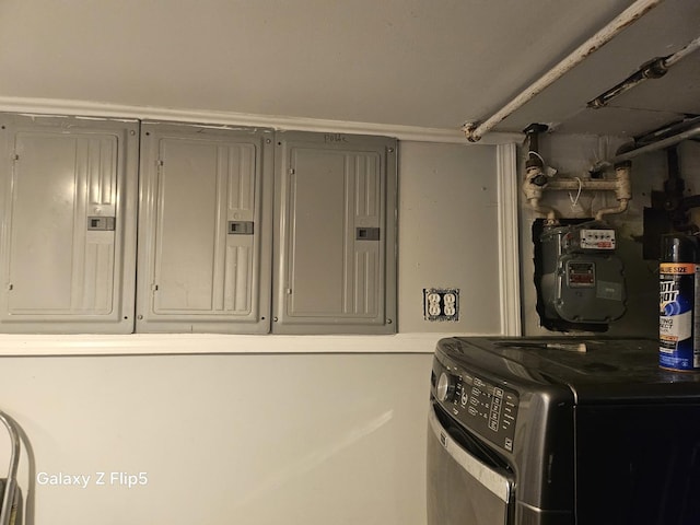 5006 W Crystal St, Chicago, IL 60651 - laundry area featuring washer / dryer, electric panel, and cabinet space