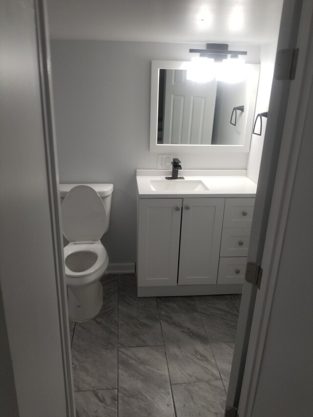 5006 W Crystal St, Chicago, IL 60651 - bathroom featuring marble look tiles and vanity