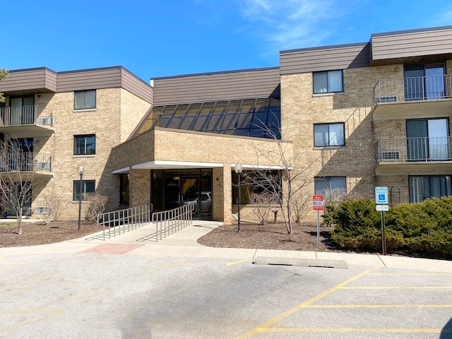 5600 Astor Ln Unit 202, Rolling Meadows, IL 60008 - view of apartment building / complex with uncovered parking
