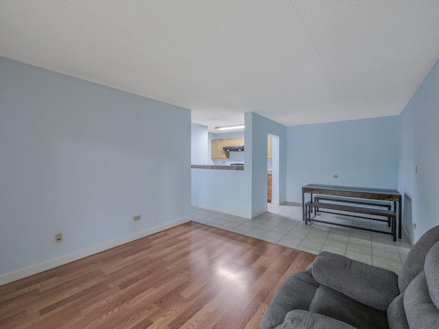 5600 Astor Ln Unit 202, Rolling Meadows, IL 60008 - unfurnished living room with wood finished floors and baseboards