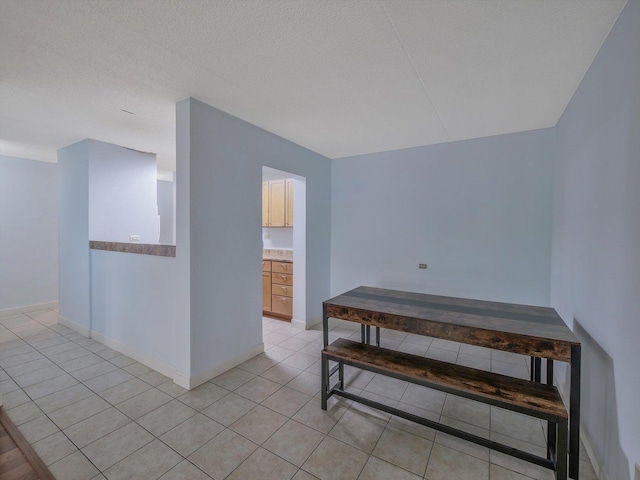 5600 Astor Ln Unit 202, Rolling Meadows, IL 60008 - empty room with light tile patterned flooring and baseboards