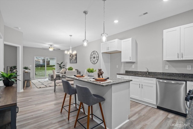 504 S Preston St, Cortland, IL 60112 - kitchen featuring dishwasher, light wood finished floors, white cabinets, dark stone counters, and recessed lighting