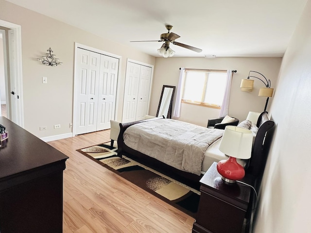 15721 Old Orchard Ct Unit 2S, Orland Park, IL 60462 - bedroom featuring multiple closets, light wood finished floors, and ceiling fan