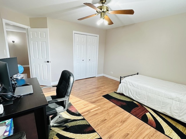 15721 Old Orchard Ct Unit 2S, Orland Park, IL 60462 - bedroom with wood finished floors, a closet, a ceiling fan, and a desk