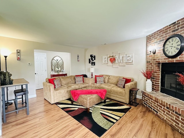 15721 Old Orchard Ct Unit 2S, Orland Park, IL 60462 - living area with light wood-style flooring and a brick fireplace