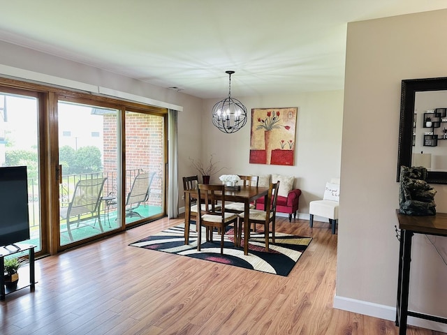 15721 Old Orchard Ct Unit 2S, Orland Park, IL 60462 - dining area with plenty of natural light, a chandelier, and wood finished floors