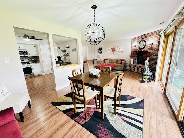 15721 Old Orchard Ct Unit 2S, Orland Park, IL 60462 - dining space with plenty of natural light, light wood-style flooring, and a chandelier