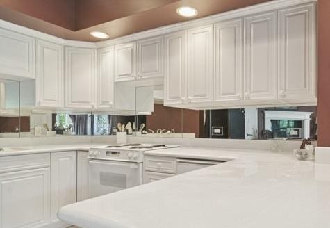 5688 Rosos Pkwy, Long Grove, IL 60047 - kitchen with white range, light countertops, recessed lighting, and white cabinetry