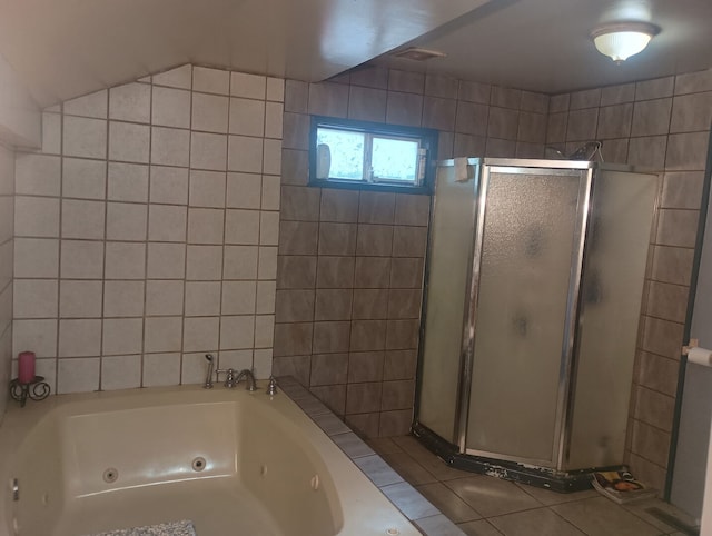 213 Edward St, Joliet, IL 60436 - full bath featuring a shower stall, a jetted tub, and tile patterned floors