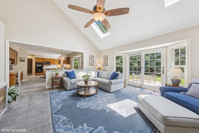 1808 Beloit Ct, Naperville, IL 60565 - living room featuring high vaulted ceiling, a skylight, plenty of natural light, ceiling fan, and light tile patterned floors