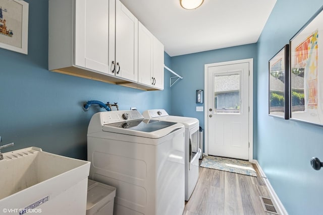 1808 Beloit Ct, Naperville, IL 60565 - washroom with cabinet space, light wood finished floors, and washer and clothes dryer