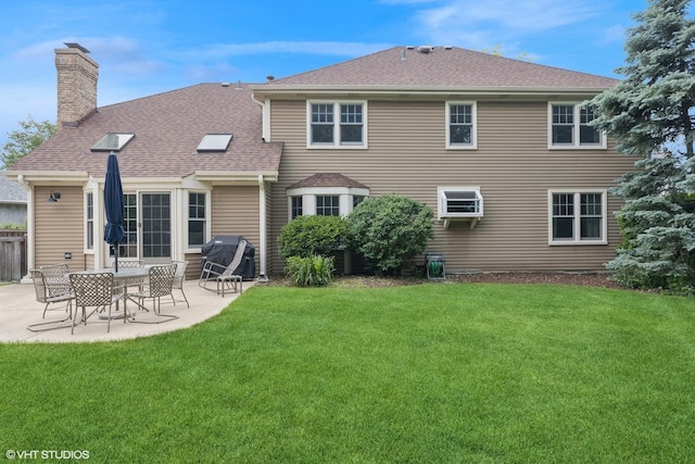 1808 Beloit Ct, Naperville, IL 60565 - rear view of property featuring a chimney, a patio, a lawn, and a shingled roof