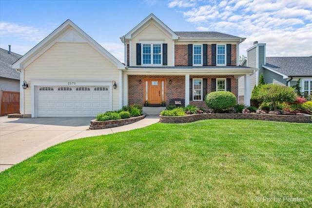 2171 Edinburgh Ln, Aurora, IL 60504 - view of front of property with brick siding, concrete driveway, an attached garage, and a front yard