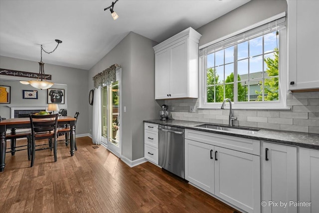 2171 Edinburgh Ln, Aurora, IL 60504 - kitchen with dishwasher, tasteful backsplash, and white cabinets
