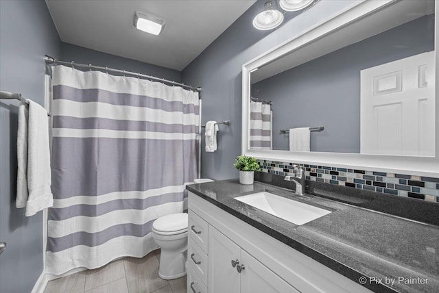 2171 Edinburgh Ln, Aurora, IL 60504 - bathroom featuring vanity, tasteful backsplash, and curtained shower
