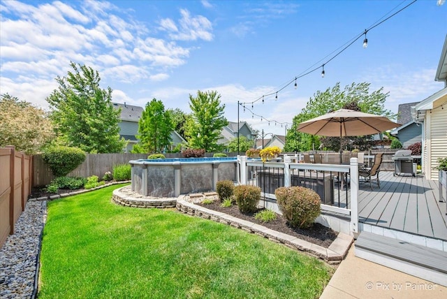 2171 Edinburgh Ln, Aurora, IL 60504 - fenced backyard featuring a deck and outdoor dining space
