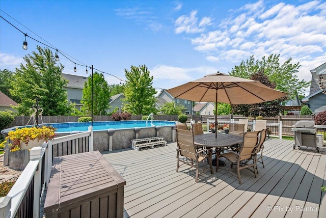 2171 Edinburgh Ln, Aurora, IL 60504 - wooden deck with grilling area, outdoor dining space, and a fenced backyard