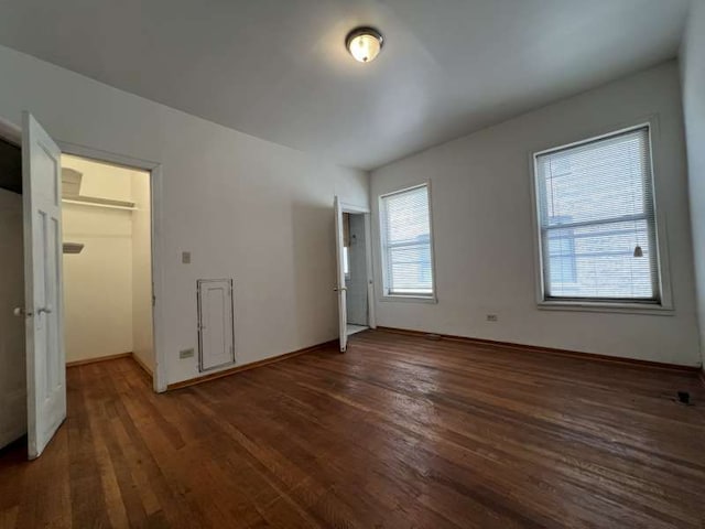 1059 E Hyde Park Blvd Unit 1, Chicago, IL 60615 - unfurnished bedroom featuring wood finished floors and a walk in closet