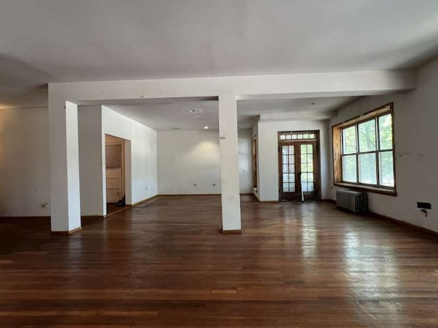 1059 E Hyde Park Blvd Unit 1, Chicago, IL 60615 - unfurnished living room featuring radiator heating unit, wood finished floors, french doors, and recessed lighting