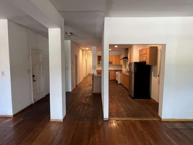 1059 E Hyde Park Blvd Unit 1, Chicago, IL 60615 - kitchen featuring freestanding refrigerator, wall chimney exhaust hood, dark wood-style floors, and light countertops