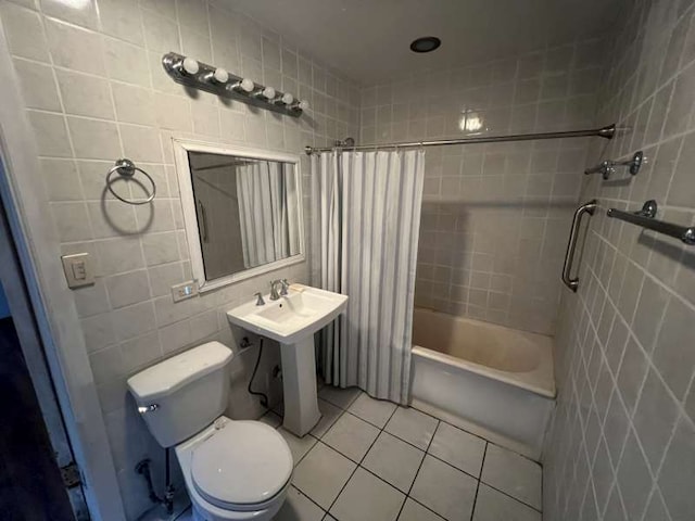 1059 E Hyde Park Blvd Unit 1, Chicago, IL 60615 - bathroom featuring tile walls, tile patterned floors, and shower / bathtub combination with curtain