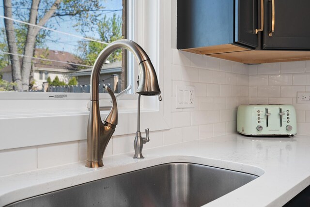 7929 N Octavia Ave, Niles, IL 60714 - kitchen view of decorative backsplash and light stone counters