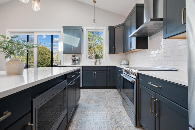 7929 N Octavia Ave, Niles, IL 60714 - kitchen with wall chimney exhaust hood, stainless steel appliances, vaulted ceiling, light countertops, and tasteful backsplash