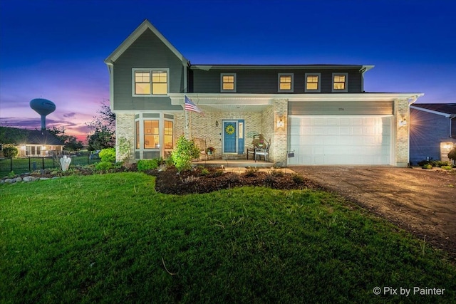 1714 Tall Tree Ln, Johnsburg, IL 60051 - traditional-style house featuring a garage, asphalt driveway, covered porch, and brick siding