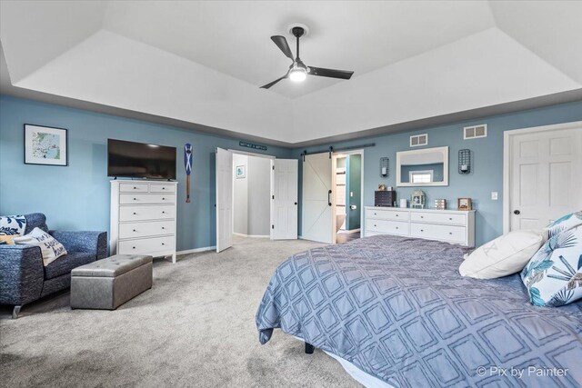 1714 Tall Tree Ln, Johnsburg, IL 60051 - bedroom featuring a raised ceiling, carpet, a barn door, and ceiling fan