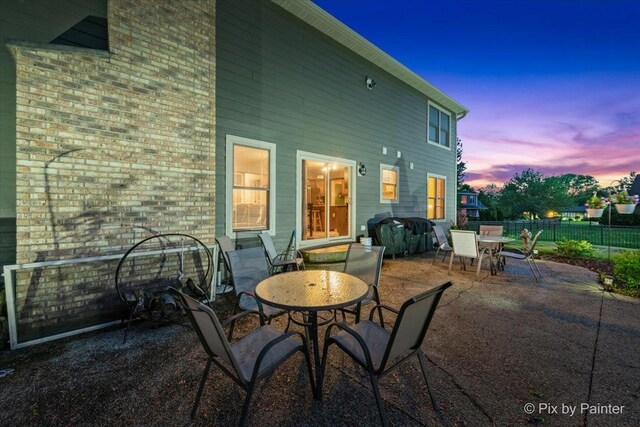 1714 Tall Tree Ln, Johnsburg, IL 60051 - patio terrace at dusk with outdoor dining space and a patio area