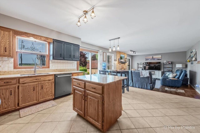 1714 Tall Tree Ln, Johnsburg, IL 60051 - kitchen featuring dishwasher, backsplash, light tile patterned floors, a kitchen island, and pendant lighting