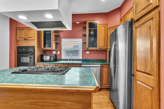 1027 N Harlem Ave, Oak Park, IL 60302 - kitchen featuring black appliances, brown cabinetry, light wood-style floors, glass insert cabinets, and recessed lighting