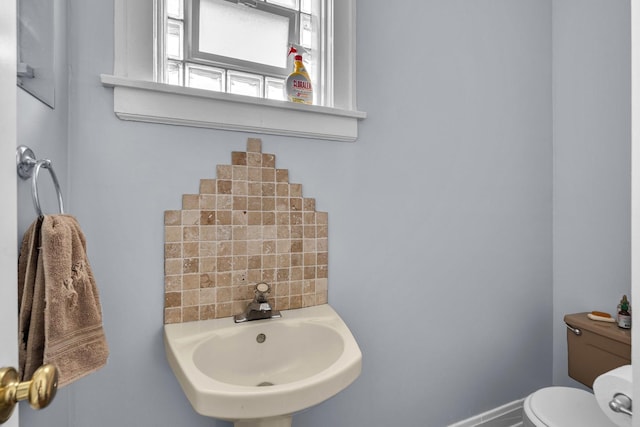 1027 N Harlem Ave, Oak Park, IL 60302 - half bathroom with a sink and tasteful backsplash