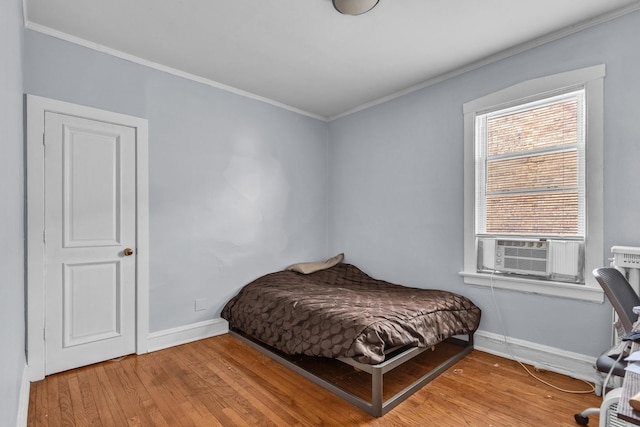 1027 N Harlem Ave, Oak Park, IL 60302 - bedroom with light wood-style flooring, crown molding, and cooling unit