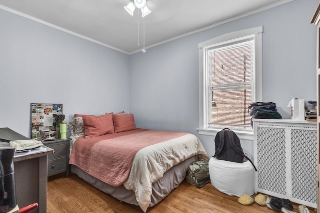 1027 N Harlem Ave, Oak Park, IL 60302 - bedroom with crown molding, wood finished floors, and multiple windows
