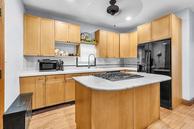 1027 N Harlem Ave, Oak Park, IL 60302 - kitchen with light wood finished floors, black appliances, open shelves, light countertops, and recessed lighting