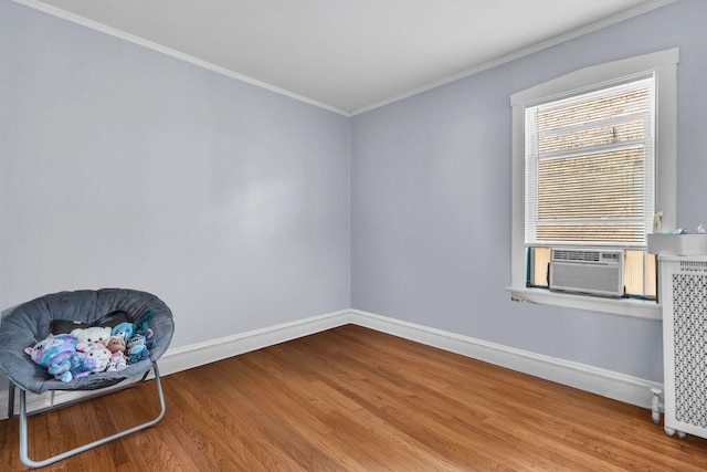 1027 N Harlem Ave, Oak Park, IL 60302 - unfurnished room featuring wood finished floors, cooling unit, ornamental molding, and radiator heating unit