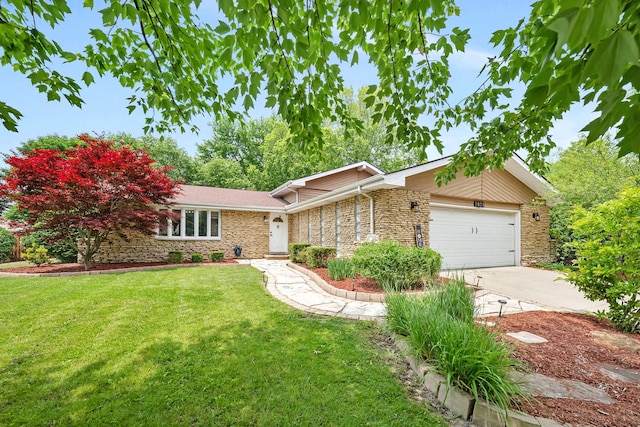1810 Jana Ln, Morris, IL 60450 - view of front facade featuring an attached garage, stone siding, a front yard, and concrete driveway