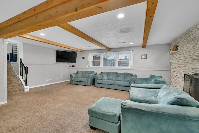 1810 Jana Ln, Morris, IL 60450 - carpeted living room featuring a stone fireplace, beam ceiling, recessed lighting, stairway, and wood walls