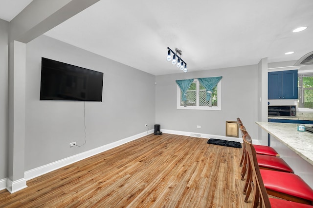 1810 Jana Ln, Morris, IL 60450 - unfurnished living room with light wood finished floors and recessed lighting